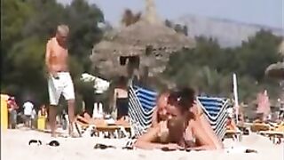 Two topless lesbian girls on the beach