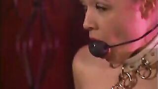 Mature mistress and her young slave in BDSM action