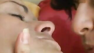 Lizandra giving a deep kiss to her wife before bed