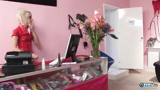 Blonde sex toy store worker gets leaped on by the brunette lesbian vampire milf