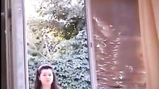 Naked girl in window is joined by even hotter girl who flash