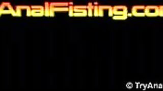 Lesbo anal fisting on a glassy table