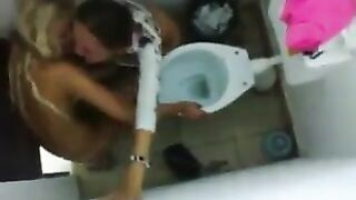 Two amateur lesbians fucking in the toilet