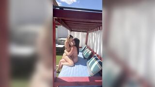 Lesbians making out before fucking outside in pool cabana