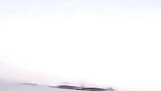 Girls kissing in the beach