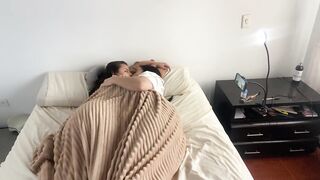 Lesbian sex under the covers on a cold morning