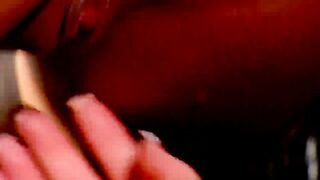 Busty blonde in fetish gear licks hot brunette's cunt