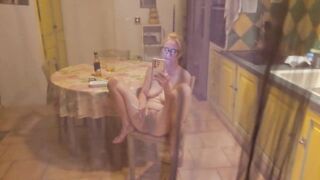 She's in the kitchen naked and she doesn't know I'm recording her and when that kinky bitch notices it turns her on