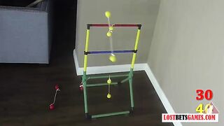 Two beautiful ladies strip while playing toss the balls
