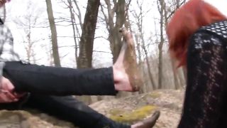 Lesbian slave is sucking on muddy toes.