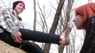 Lesbian slave is sucking on muddy toes.