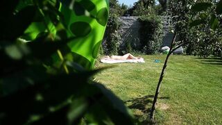 I spy on my stepmother, she is sunbathing naked in the yard