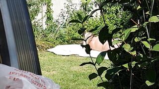I spy on my stepmother, she is sunbathing naked in the yard