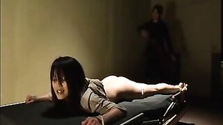 Lesbian BDSM bound woman is whipped by sadistic guard