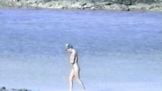 Nudist beach a bathing mermaid in the dunes feels unobserved