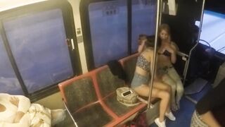 lesbians entertain themselves in public transport