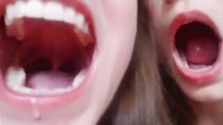 Sisters playing with spit