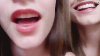 Sisters playing with spit