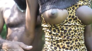 2 African tribe girl having fun with the village chief in the middle of the forrest