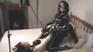 Lesbian couple enjoy in rubber catsuit