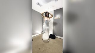 Hot trans cd in cute white dress teasing huge tits and ass