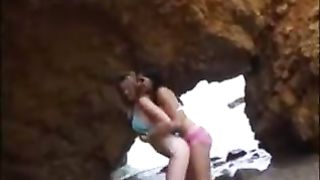 Beach babes strapping on