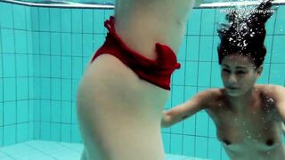 Lesbian fun underwater and naked stripping