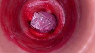 The camera inside the deep pussy records a huge ejaculation with a stuck condom