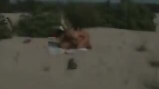 Italian lesbian couple fingering on the beach for voyeurs