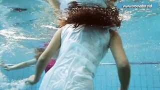 Hotly dressed teens in the pool