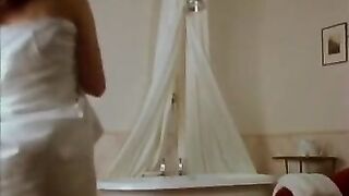 Sarah Parker as a maid prepares bath for Lila Baumann