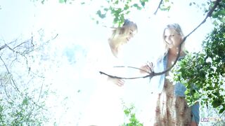 2 blond divas indulge in a lesbo session during their walk in the woods