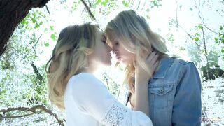 2 blond divas indulge in a lesbo session during their walk in the woods