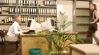 Lesbian in office with cucumber