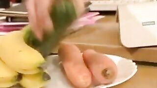 Lesbian in office with cucumber