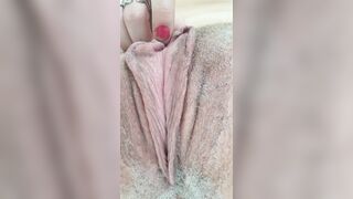 Rubbing stretching pulsing pink twat in bathroom close up