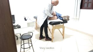 Proctologist performs anal exam on constipated patient.