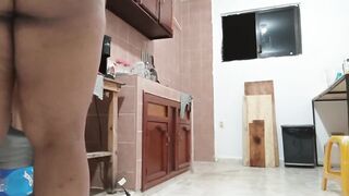 Overweight cutie in a belt cooking