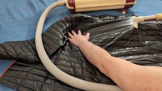 Vacuuming Darksome Shark Ghost Whisperer Down Jacket with Vintage Electrolux Vacuum Cleaner