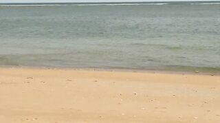 Slim hotty walks along the beach and swims in the sea. meet me