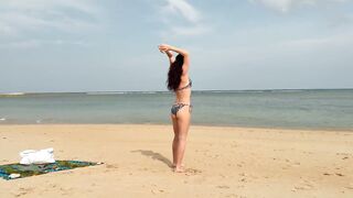 Slim hotty walks along the beach and swims in the sea. meet me