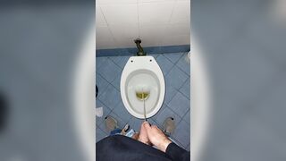a youthful stud went into a messy public throne-room to pee and stroke