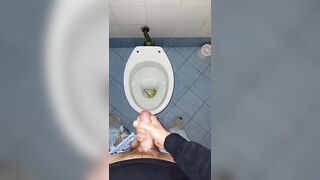 a youthful stud went into a messy public throne-room to pee and stroke