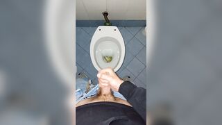 a youthful stud went into a messy public throne-room to pee and stroke