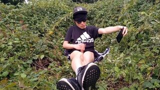 Cute French-Oriental homosexual twink jerks off his bald knob outside cums thick cum sticking to his fingers