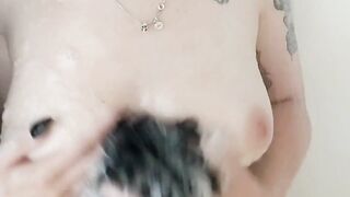 Tattooed cutie soaping up her boobs