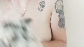 Tattooed cutie soaping up her boobs