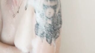 Tattooed cutie soaping up her boobs