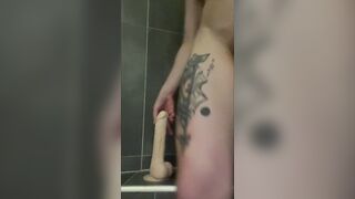 Gym angel playing with her large sextoy below the shower
