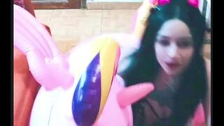 Cosplay cutie has pleasure with a pink inflatable unicorn